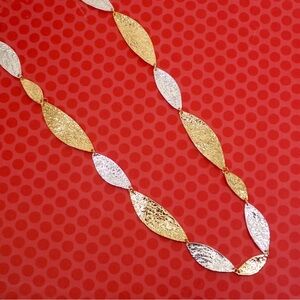 Long silver and gold necklace with metal hammered textured hand-link sections